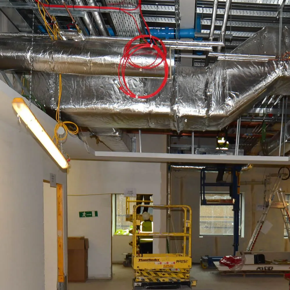Building fit out showing exposed roof conduits